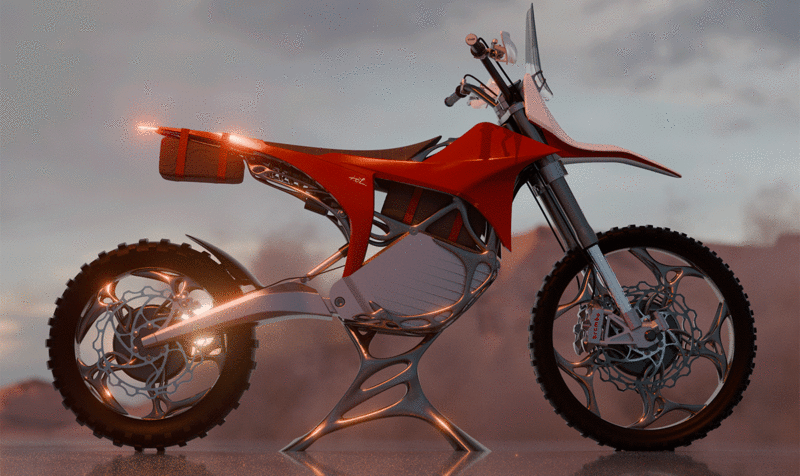 Motocicleta elèctrica offroad roja y blanca en un paisaje desértico vista de lado y con las luces de posición y faros encendidas